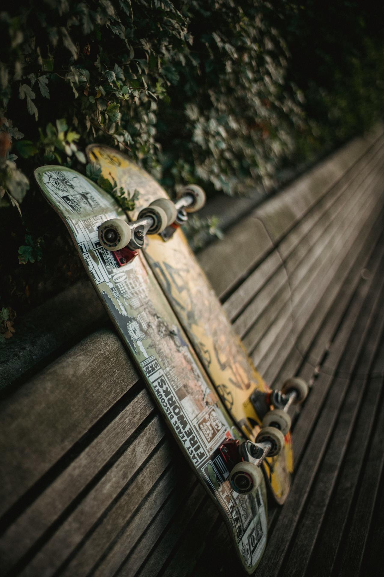 Skateboards placed on wooden bench